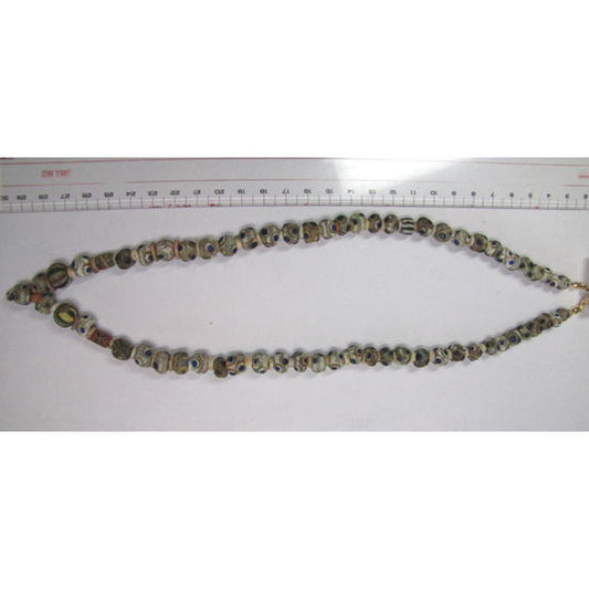 Строка бусин с изображением финикийского глаза