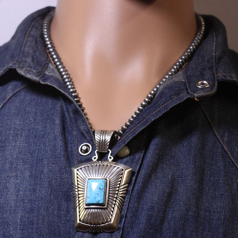 किंगमैन पेंडेंट बाय कैल्विन मार्टिनेज