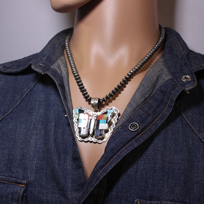 ஜூனி தயாரித்த பட்டாம்பூச்சி பதக்கம்