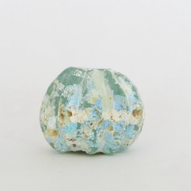 Antike römische irisierende Glas-Perle in Mandarinenfarbe