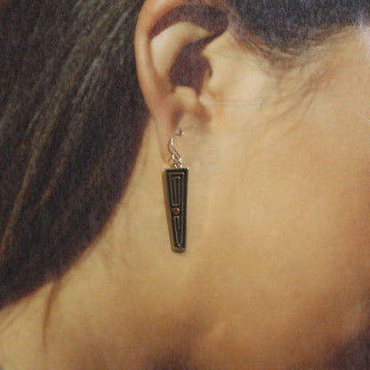 Boucles d'oreilles superposées par Albert Nells